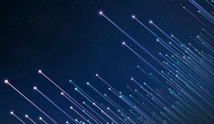 Abstract image of several beams of light with orbs at the end reaching upwards at an angle towards the dark blue night sky
